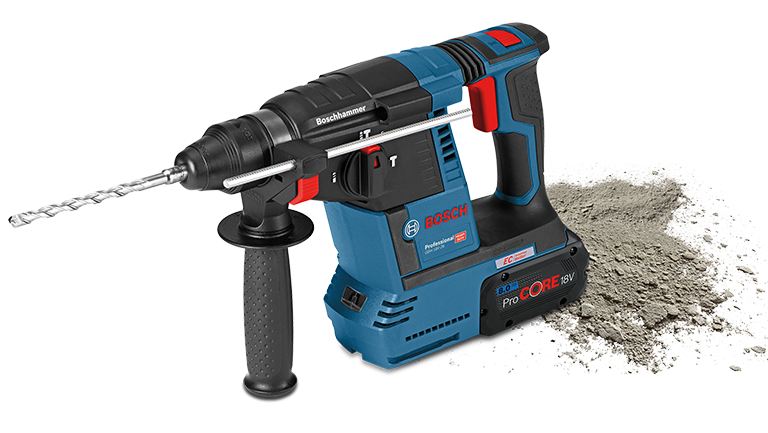+151 A blue Bosch Professional cordless hammer lies next to gray concrete dust.