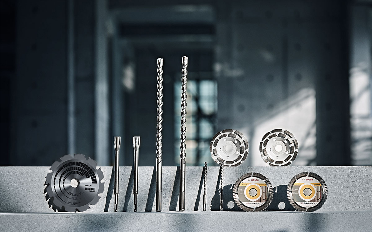 Bosch Professional Tools: various drills and saw blades on concrete.